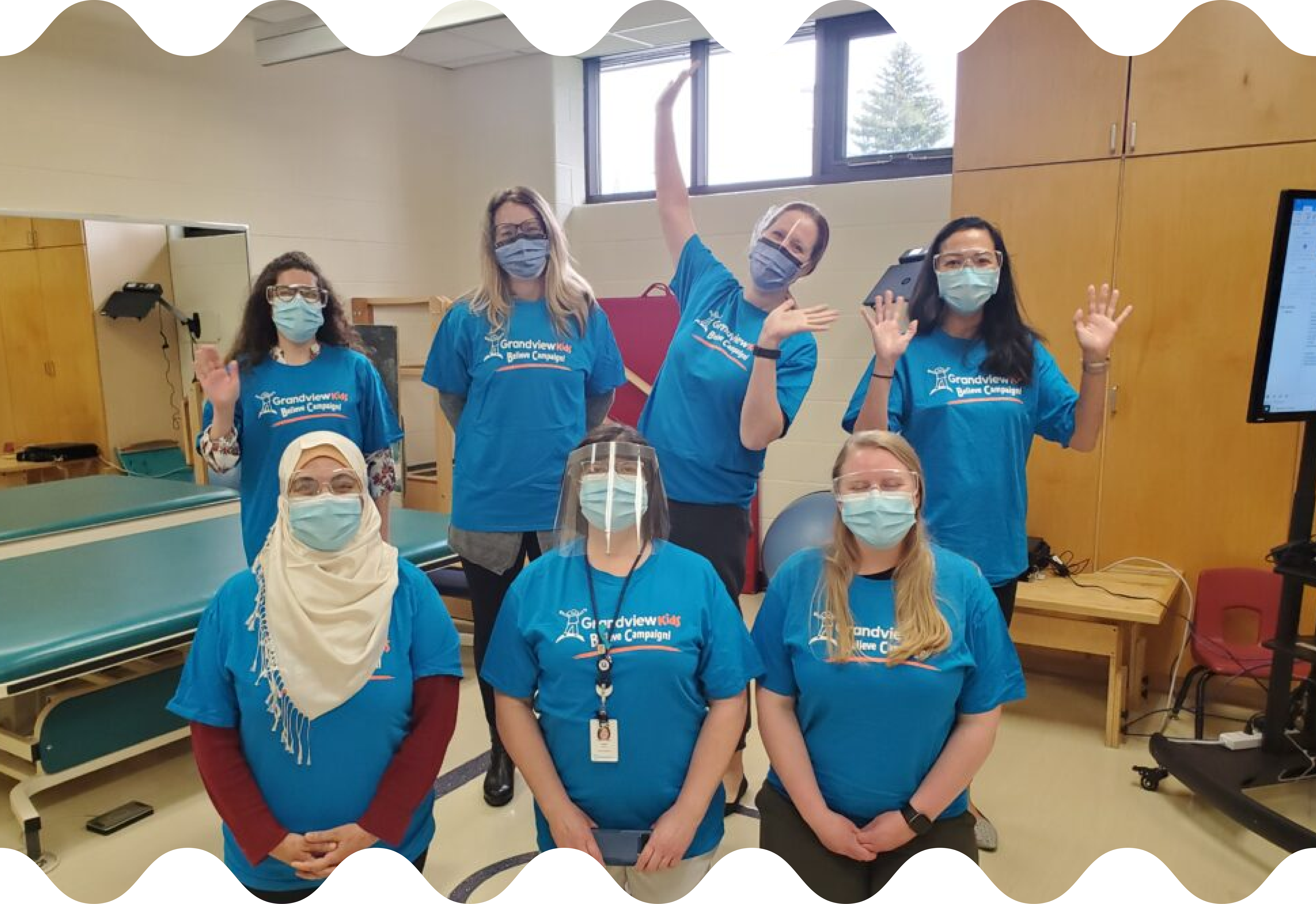Team Grandview Members, part of the Complex Care Program, pose wearing masks and eye protection.